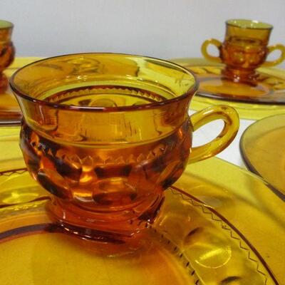 Lot 53 - Amber Depression Fostoria Glass Plates With Matching Cups 