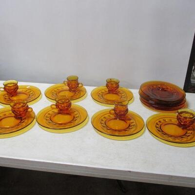 Lot 53 - Amber Depression Fostoria Glass Plates With Matching Cups 