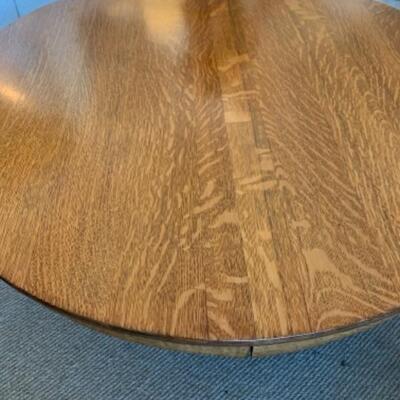 Lot 82. Round oak coffee table, 45 inches in diameter, 16.5 inches high--$45