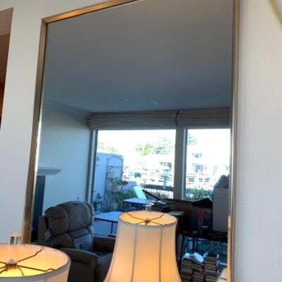 Lot 89. Two contemporary mirrors (one 40 x 35 inches; the other 54.5 x 32.5 inches (beveled) $50