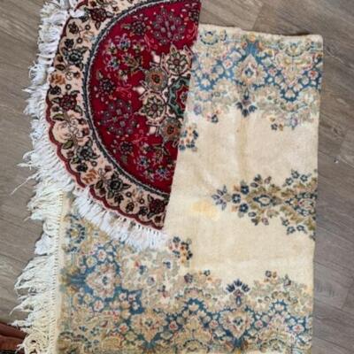 Lot 92. Two area rugs, one 36 inches in diameter; the other 72 x 47 inches--$50