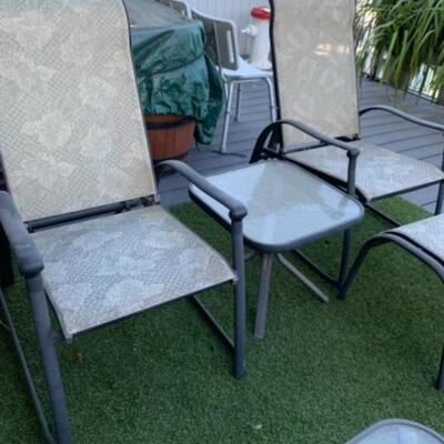 Lot 95. Patio setâ€”6 reclining chairs, table (65â€x40â€), umbrella stand, ottomans and small glass tables--$125