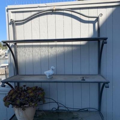 Lot 96. Wrought iron tiered flower pot stand--$35