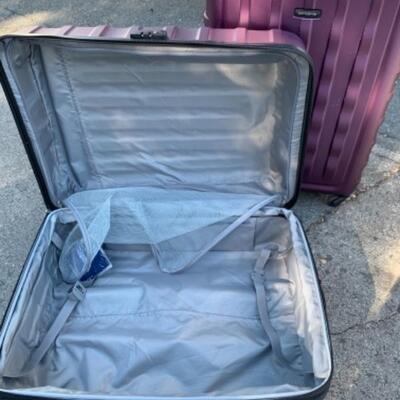Lot 102. Two hard case Samsonite suitcases on wheels and luggage scale--$50