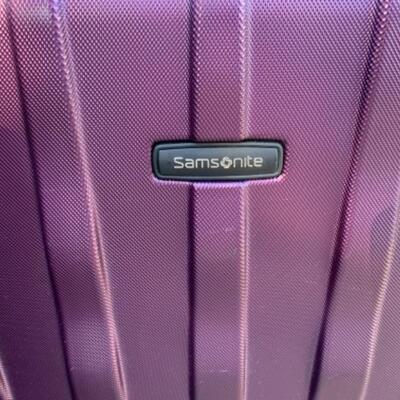 Lot 102. Two hard case Samsonite suitcases on wheels and luggage scale--$50