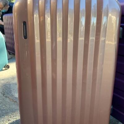 Lot 103. Two hard case suitcasesâ€”one London Fog, the other Constellation (with minor damage)--$35
