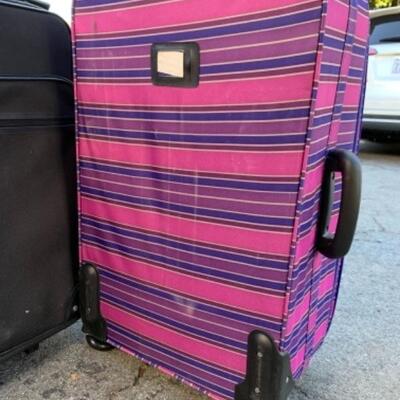 Lot 104. Two soft suitcasesâ€”one Globetrotter, one Envy in excellent condition--$35