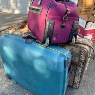 Lot 105. Three pieces of luggageâ€”one hard Samsonite, one soft Leisure suitcase and one rolling carry-on bag--$45 