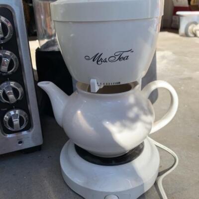 Lot 113. Collection of small appliancesâ€”coffee maker, dehydrater, tea maker, electric kettle, pressure cooker, Kitchen Aid toaster oven...
