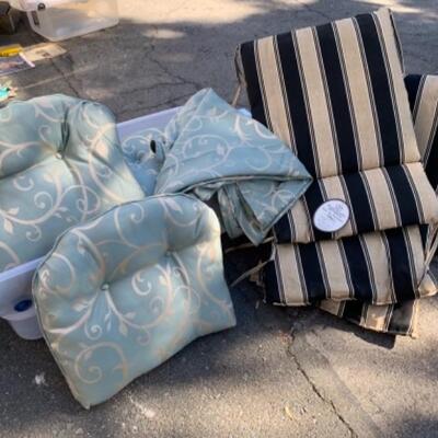 Lot 115. Lounge chair cushions, sets of 4 and 5 seat cushions and tablecloth--$55