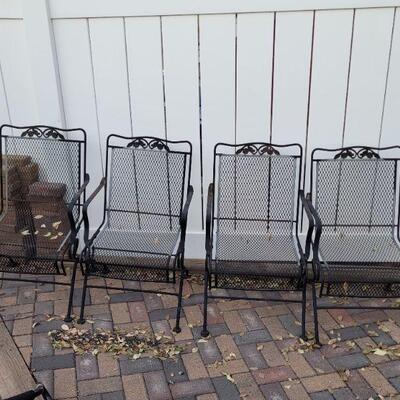 Lot #91: (4) Wrought Iron Black Rocking Outdoor Chairs