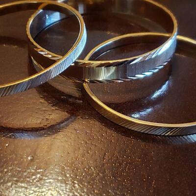 Lot 113: Bracelet lot (4 Bangles & 1 Cuff)