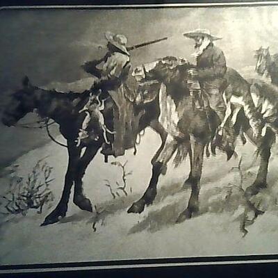Remington gold  art work framed in wood
