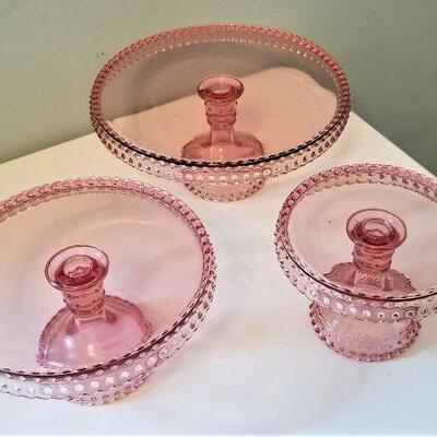 Lot #37  Set of three Pink Glass Cake Plates