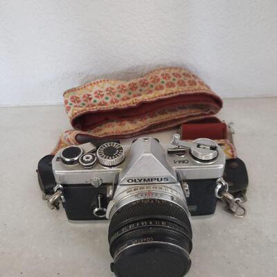 Lot 136: Olympus 35mm Camera with Strap