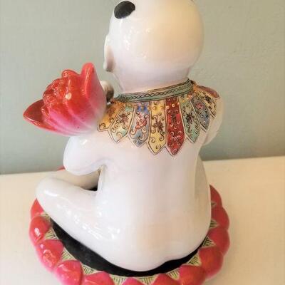 Lot #62  Ceramic Asian Figure holding Lotus Blossom