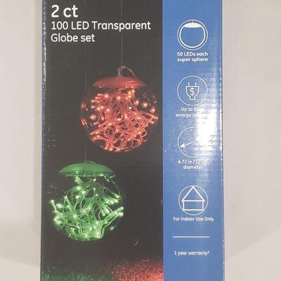 LOT 262:  (2) Transparent LED Christmas Globes