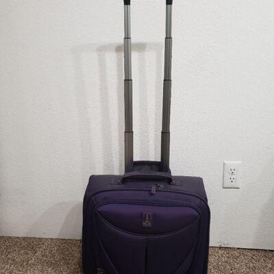 Lot 295: Purple Travelpro Luggage