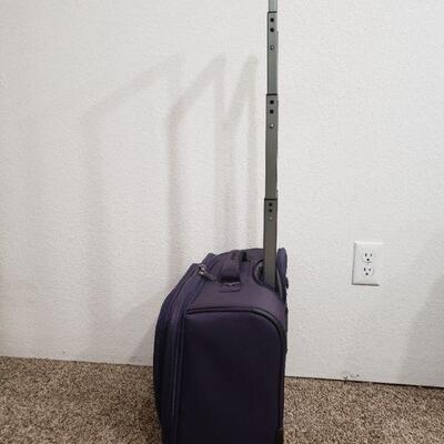 Lot 295: Purple Travelpro Luggage