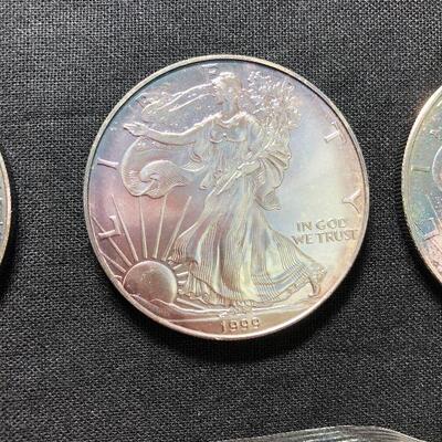 Lot 127 -  Coins and Silver (5 Silver Eagles and a 1998 Merry Christmas Coin)