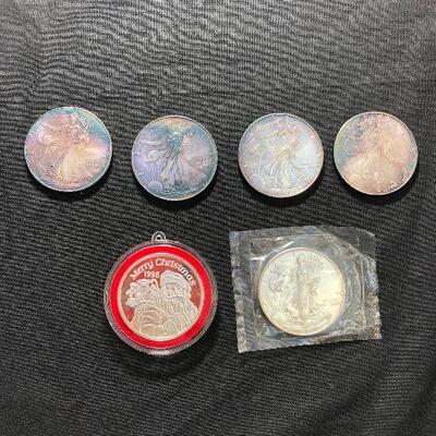 Lot 127 -  Coins and Silver (5 Silver Eagles and a 1998 Merry Christmas Coin)