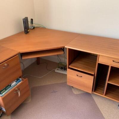 Lot 8U. Oak corner office desk on wheels, 71” long, 29” high, 55” deep, with floor pad—52” x 44”--$85