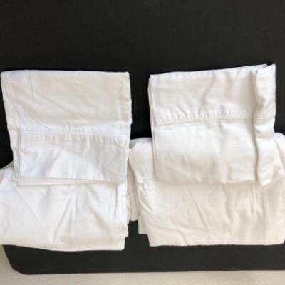 Lot 34U. One set of king sheets with two pillow cases, 2 pillow protectors (new), and 3 used king sheets--$75