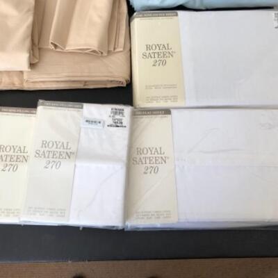 Lot 34U. One set of king sheets with two pillow cases, 2 pillow protectors (new), and 3 used king sheets--$75