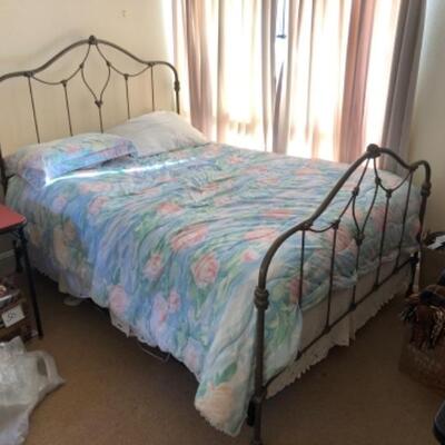 Lot 56U. Queen-size wrought iron bedframe with queen-size mattress (new), plus box frame  (new); bedding includes electric blanket,...