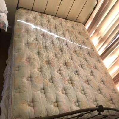 Lot 56U. Queen-size wrought iron bedframe with queen-size mattress (new), plus box frame  (new); bedding includes electric blanket,...