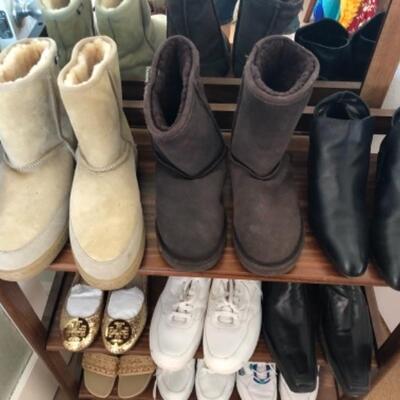 Lot 63U. Nine pairs of shoesâ€”3 menâ€™s running, sizes 9.5 to 11, mukluks, menâ€™s black leather loafers, Sudini boots, sandals,...