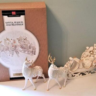 Lot #167  Porcelain Christmas display - Reindeer, Santa, and Sleigh