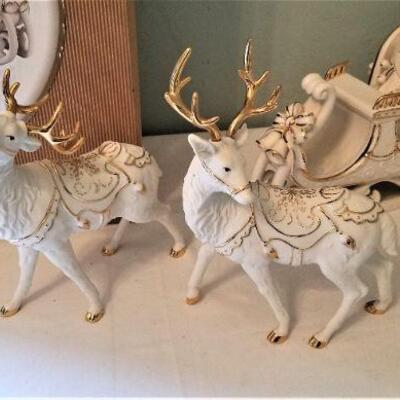 Lot #167  Porcelain Christmas display - Reindeer, Santa, and Sleigh
