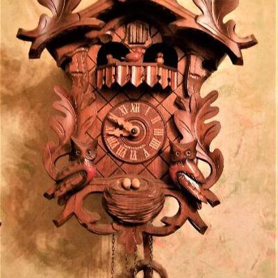 Lot #194  Cool Carved German Cuckoo Clock with moving figures