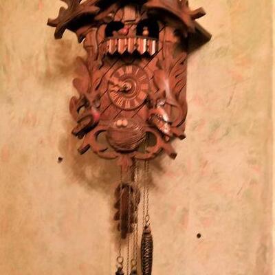 Lot #194  Cool Carved German Cuckoo Clock with moving figures