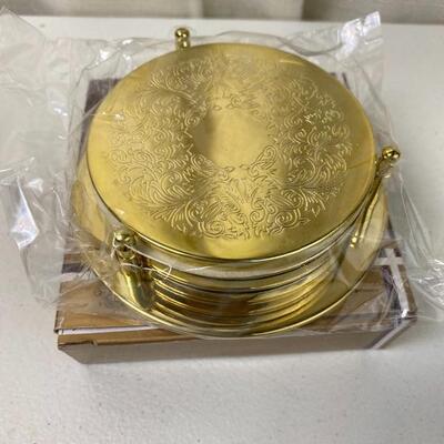 Lot# 135 S Set of New Gold Toned Wine Coasters