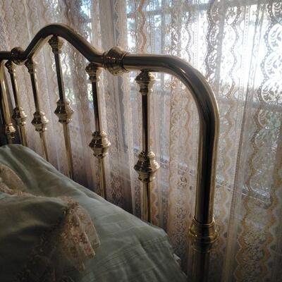 LOT 3   DOUBLE BRASS BED, BEDDING, TABLE, AND CURTAINS