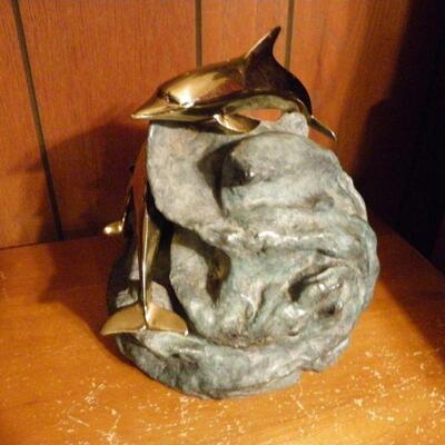 "Hand Sculpture Dolphin's by Dan Parker."