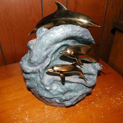 "Hand Sculpture Dolphin's by Dan Parker."