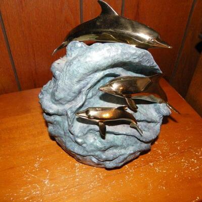"Hand Sculpture Dolphin's by Dan Parker."