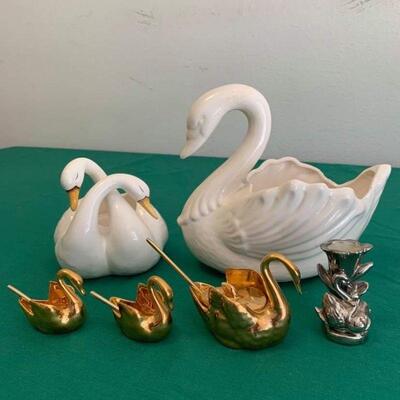 LOT 320 GROUP OF SWANS 