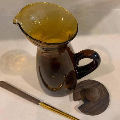 Vintage pitcher with lid and stirring spoon