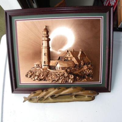 Beautiful Copper Light House portrait and wood dolphins.