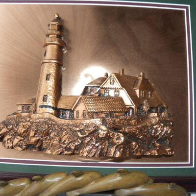 Beautiful Copper Light House portrait and wood dolphins.