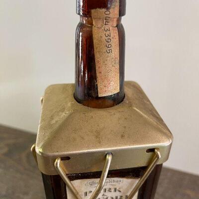 L154: Mr. Tilford whiskey Blend On metal stands on music box