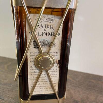 L154: Mr. Tilford whiskey Blend On metal stands on music box