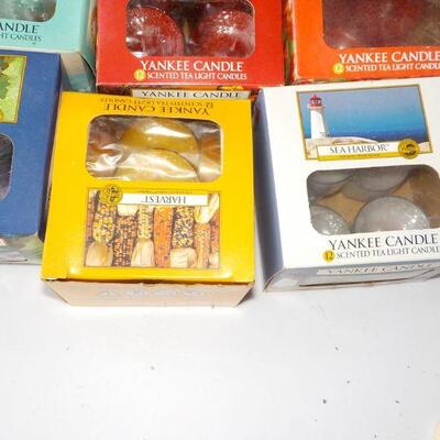 12 boxes of  tea lite candles assorted scents.