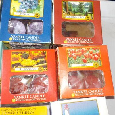 12 boxes of  tea lite candles assorted scents.