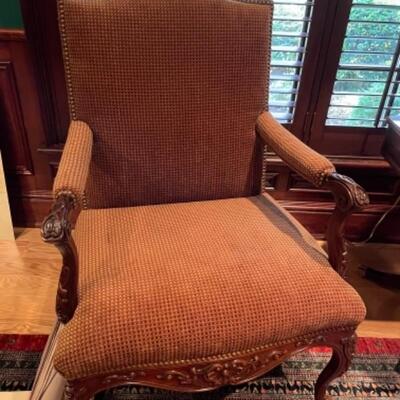 Two armchairs with carved wood detail