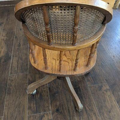 Vintage Oak Can Back Rolling Chair 